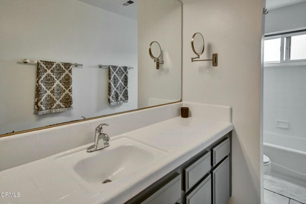 508 Village Road Port Hueneme, CA 93041 - Photo 23 of 38 a bathroom with a sink and a mirror