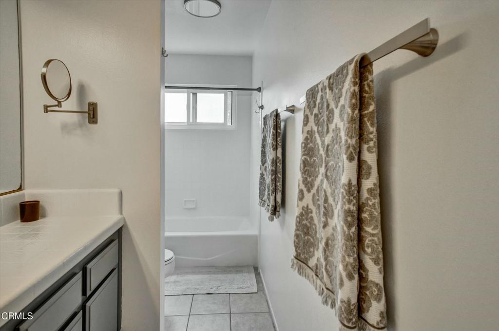 508 Village Road Port Hueneme, CA 93041 - Photo 24 of 38 a bathroom with a shower curtain and a window