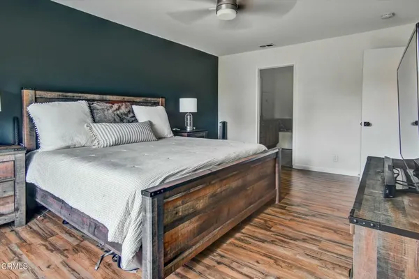 a bed room with a bed and a couch
