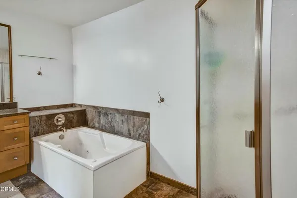 a white bath tub sitting in a bathroom