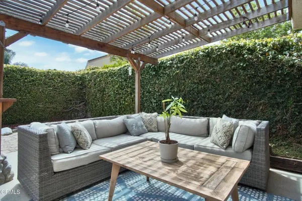 a view of an outdoor sitting area with furniture