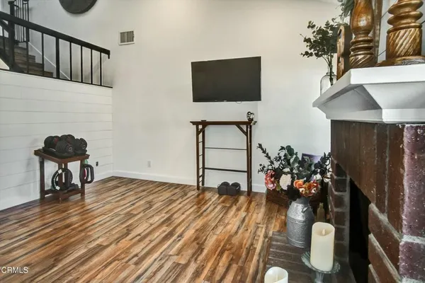 a view of a livingroom with furniture and wooden floor