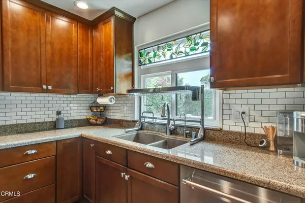 a kitchen with a sink and a window