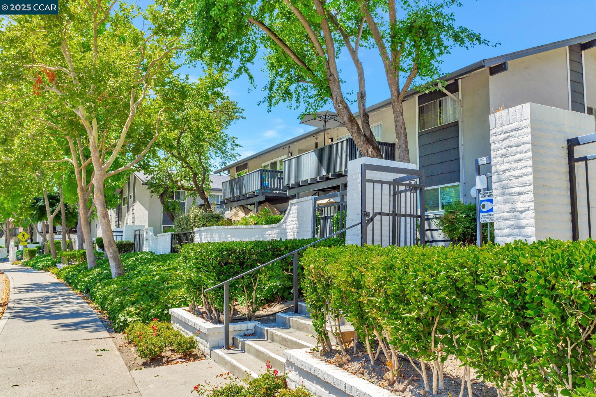 9085 Alcosta Boulevard, Unit 340 San Ramon, CA 94583 - Photo 25 of 25 a view of a house with a yard and plants