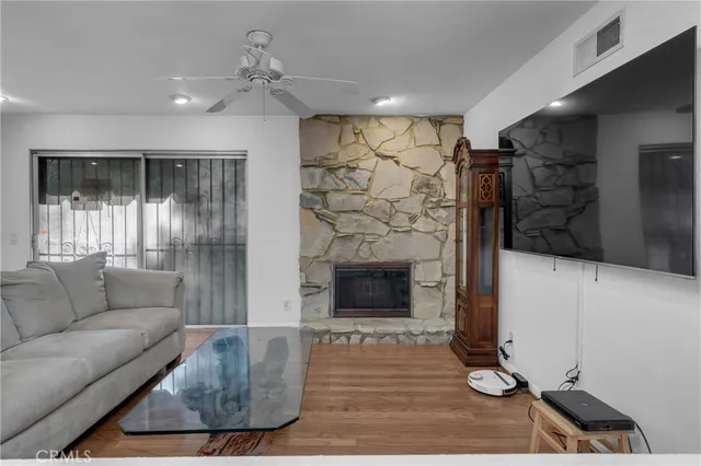 a living room with furniture and a fireplace