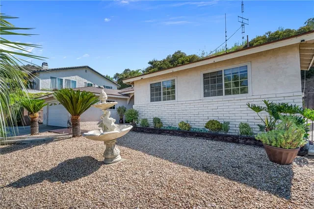 a view of a backyard with sitting area
