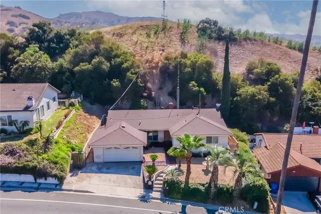 an aerial view of a house with a garden