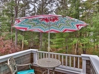 18 Red Pine Lane Wareham, MA 02571 - Photo 17 of 37 a view of a wooden deck with a bench