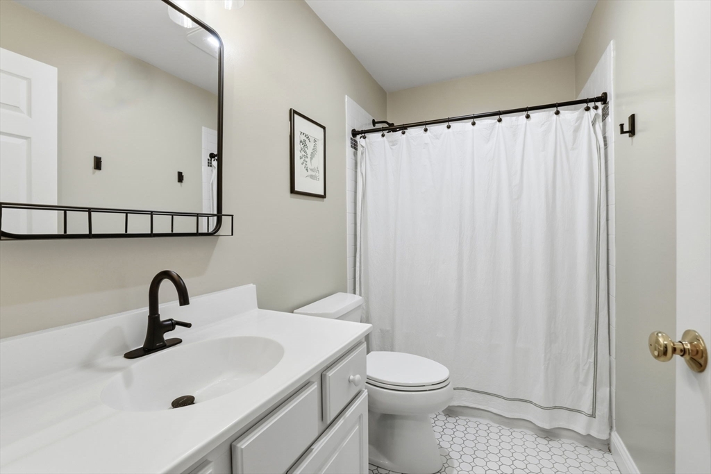 18 Red Pine Lane Wareham, MA 02571 - Photo 19 of 37 a bathroom with a sink mirror and toilet
