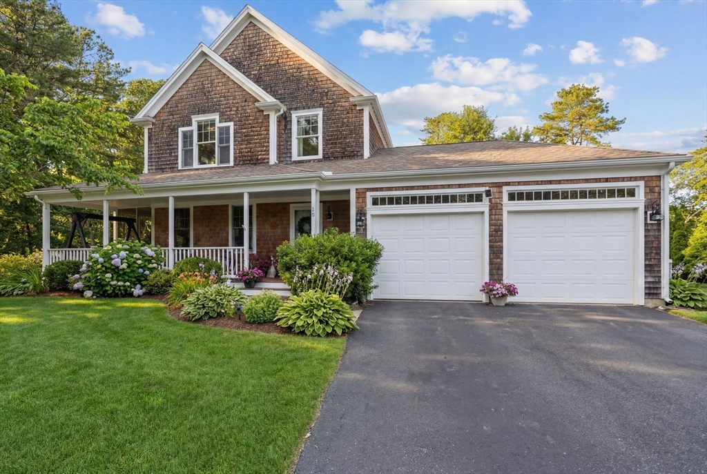 18 Red Pine Lane Wareham, MA 02571 - Photo 2 of 37 a front view of a house with a yard and garage