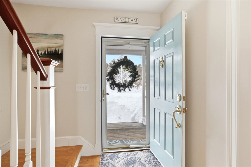18 Red Pine Lane Wareham, MA 02571 - Photo 4 of 37 a view of a hallway with wooden floor and stairs