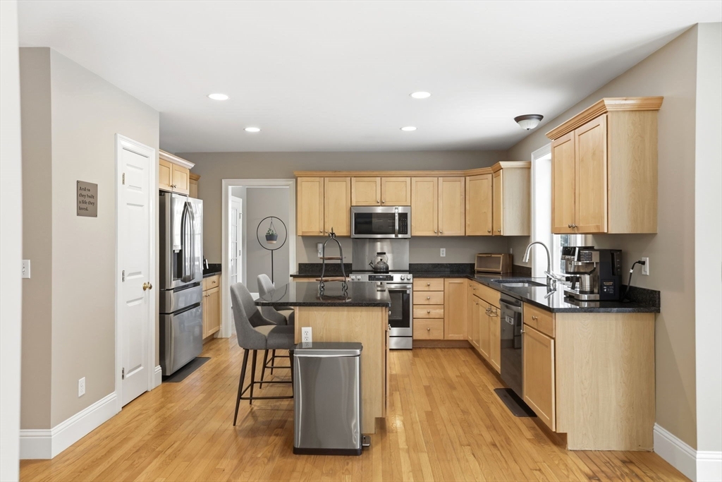 18 Red Pine Lane Wareham, MA 02571 - Photo 8 of 37 a kitchen with a refrigerator a counter top space and stainless steel appliances
