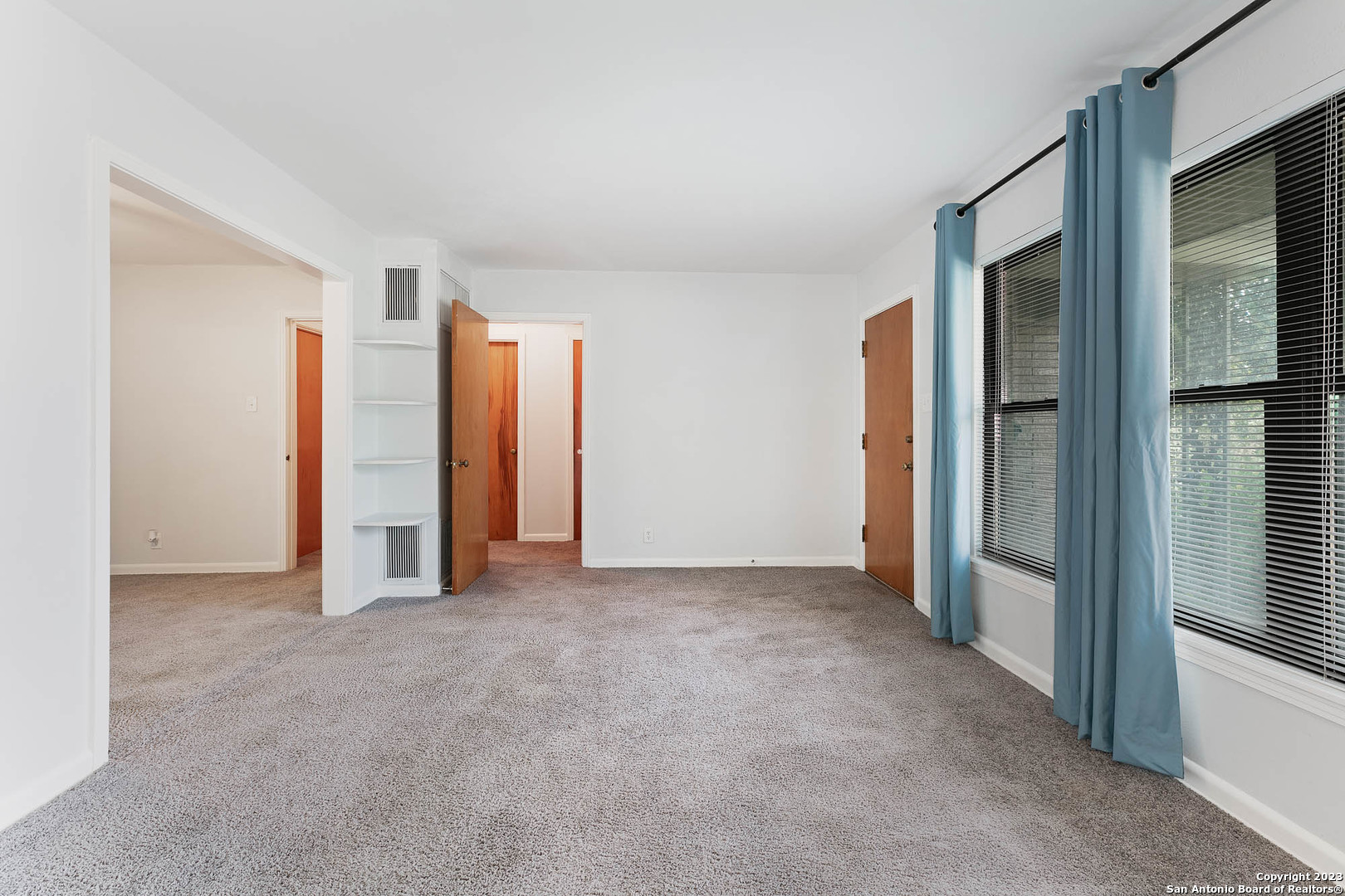 463 Cherry Ridge San Antonio, TX 78213 - Photo 3 of 19 an empty room with closet and a hallway