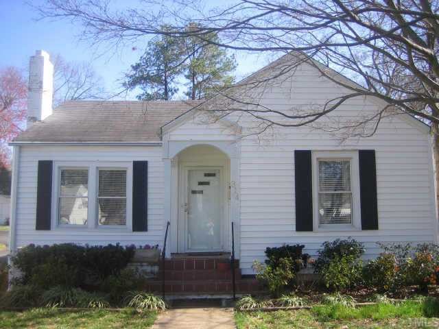 314 Hudson Street Raleigh, NC 27608 - Photo 1 of 1 a front view of a house with a garden