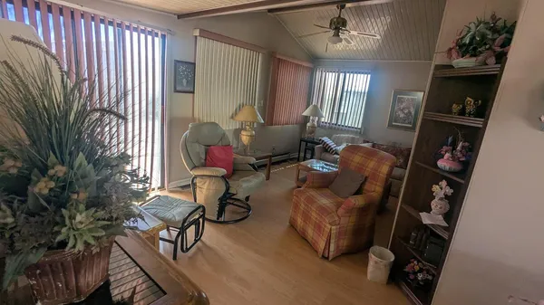 a living room with furniture and a window