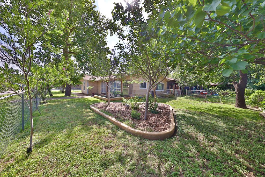 206 Austin Street Ingram, TX 78025 - Photo 1 of 18 a view of a house with a backyard
