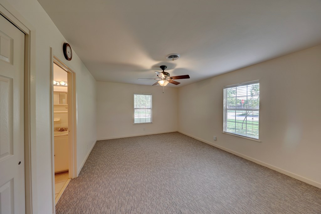 206 Austin Street Ingram, TX 78025 - Photo 15 of 18 a view of an empty room with a window