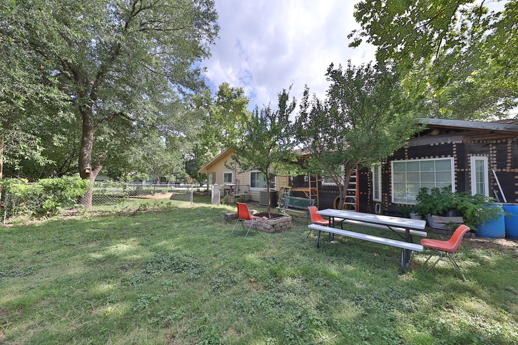 206 Austin Street Ingram, TX 78025 - Photo 17 of 18 a view of a house with a yard porch and sitting area