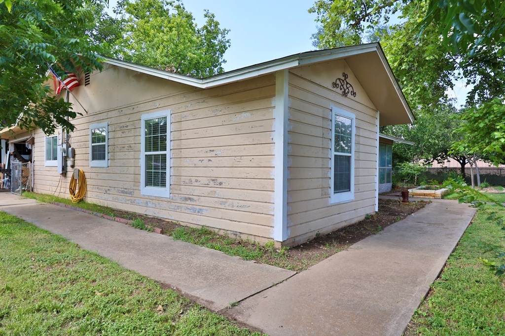 206 Austin Street Ingram, TX 78025 - Photo 2 of 18 a view of a house with a yard