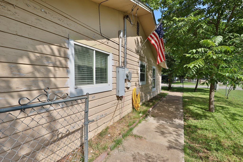 206 Austin Street Ingram, TX 78025 - Photo 3 of 18 a view of a house with a yard