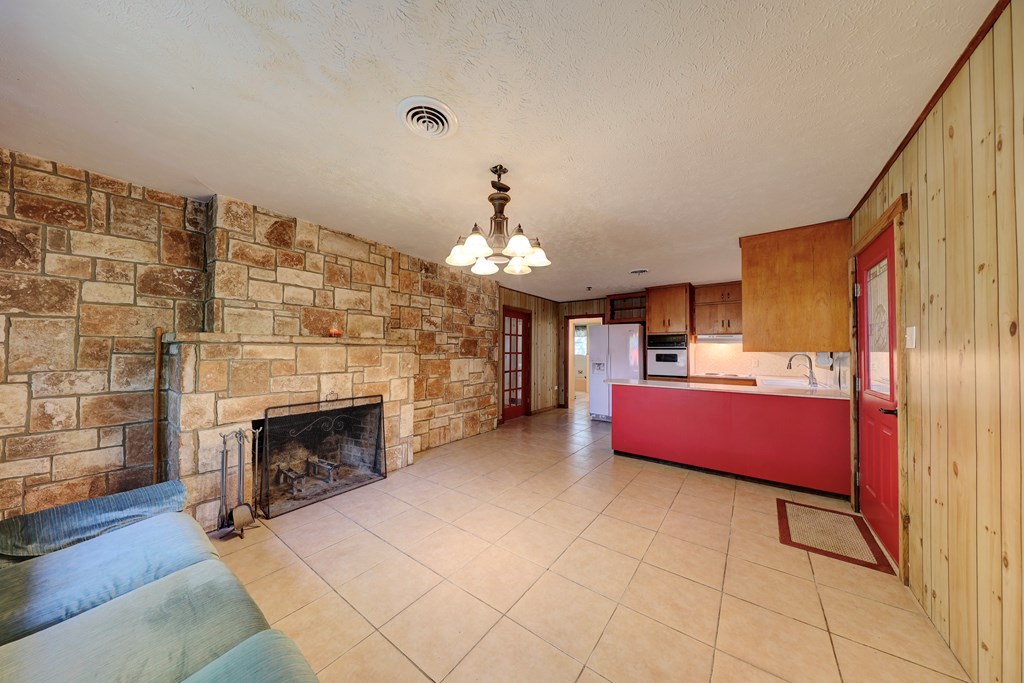 206 Austin Street Ingram, TX 78025 - Photo 4 of 18 a living room with furniture and a fireplace