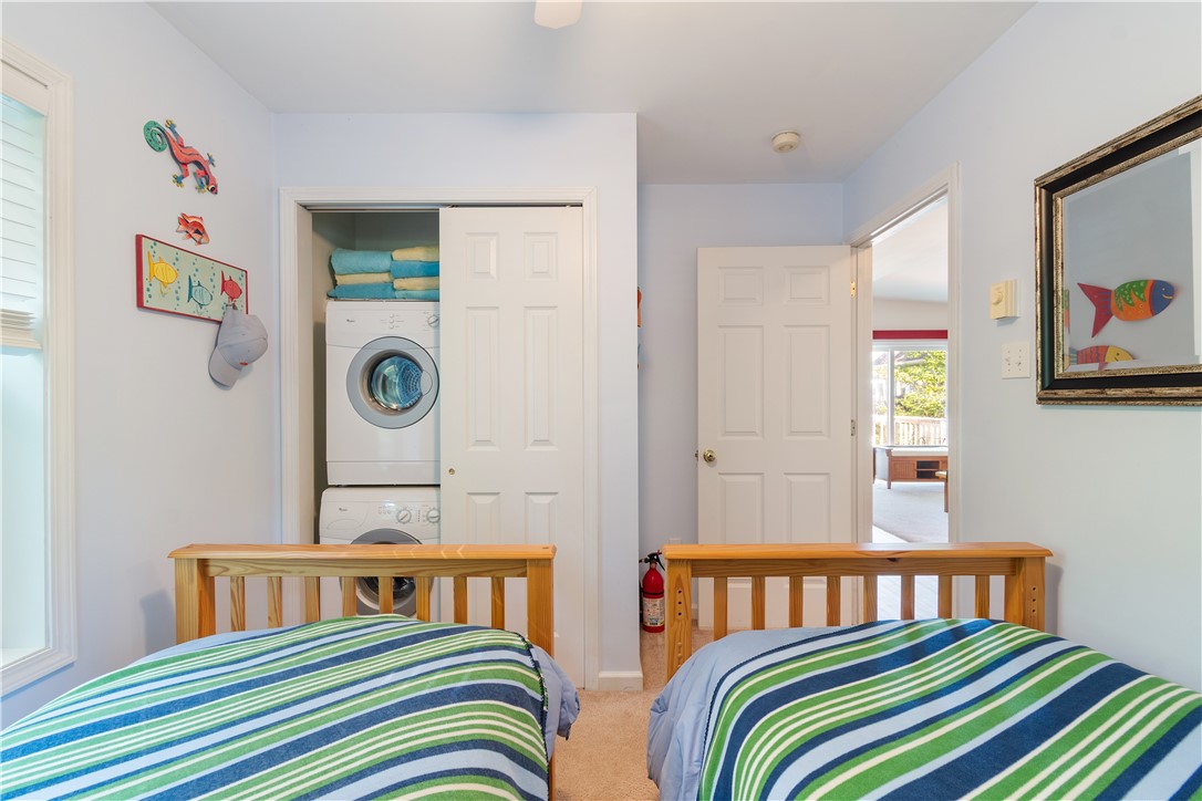 6925 Emerald Point Road Sodus, NY 14555 - Photo 18 of 32 The second bedroom with STACKABLE LAUNDRY