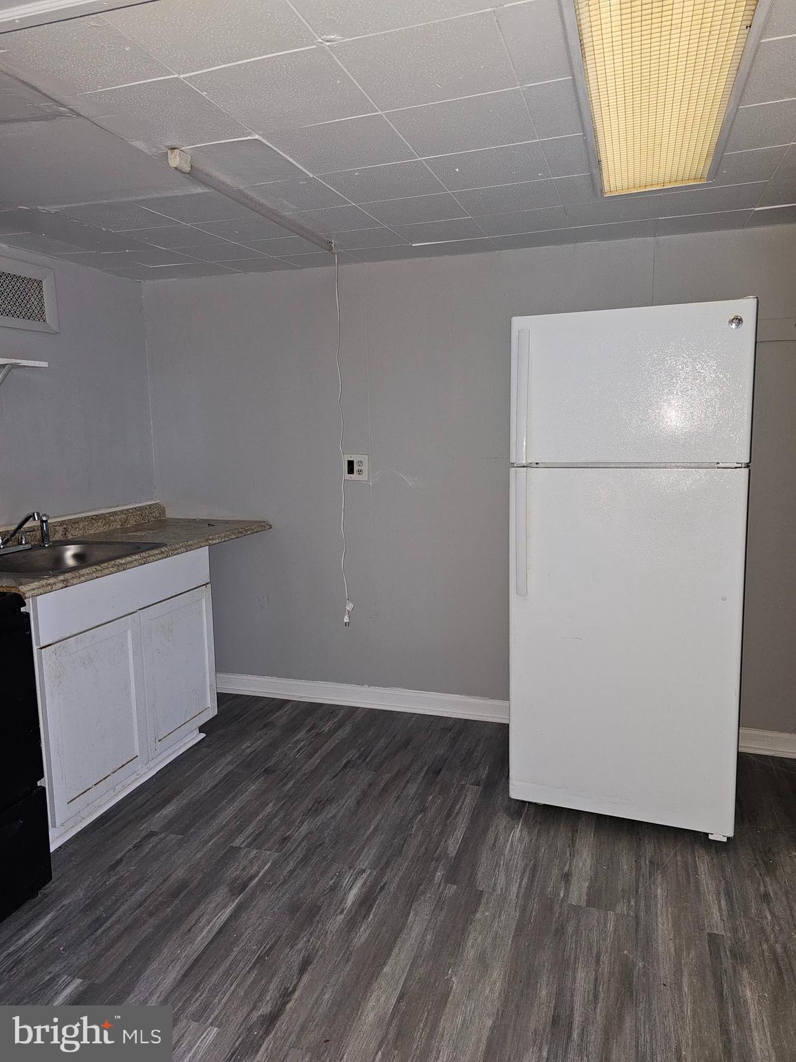 3607 Belair Road, Unit BSMT Baltimore, MD 21213 - Photo 8 of 14 a view of a storage & utility room with washer and dryer