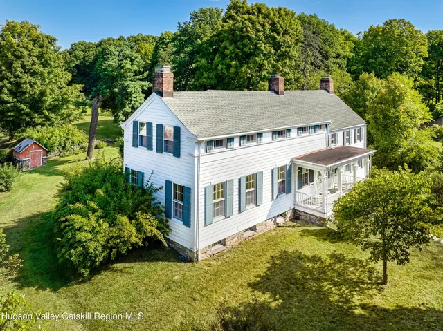 a aerial view of a house with a yard