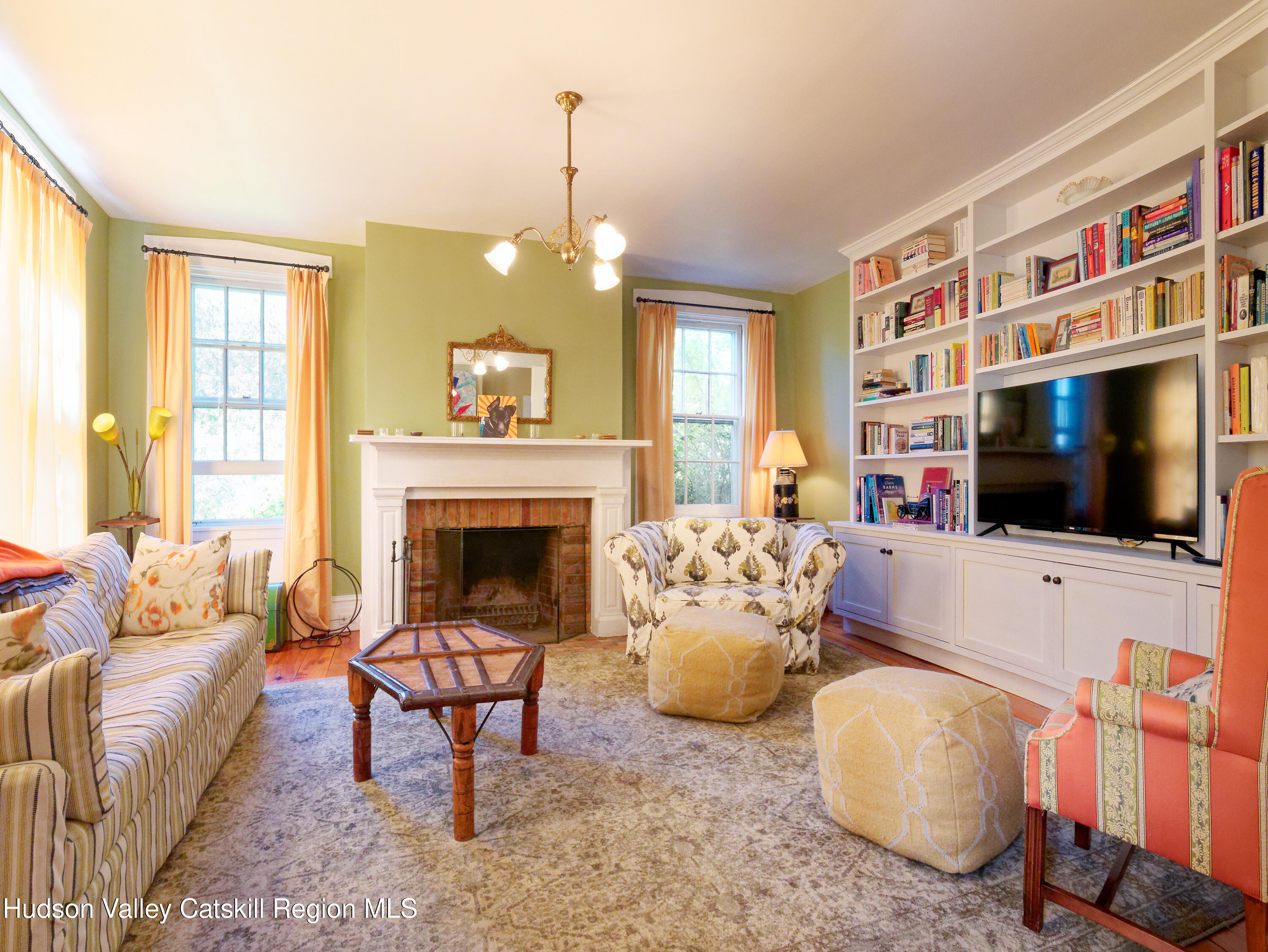 5 Fulton Homestead Road Red Hook, NY 12571 - Photo 11 of 41 a living room with furniture fireplace and a flat screen tv