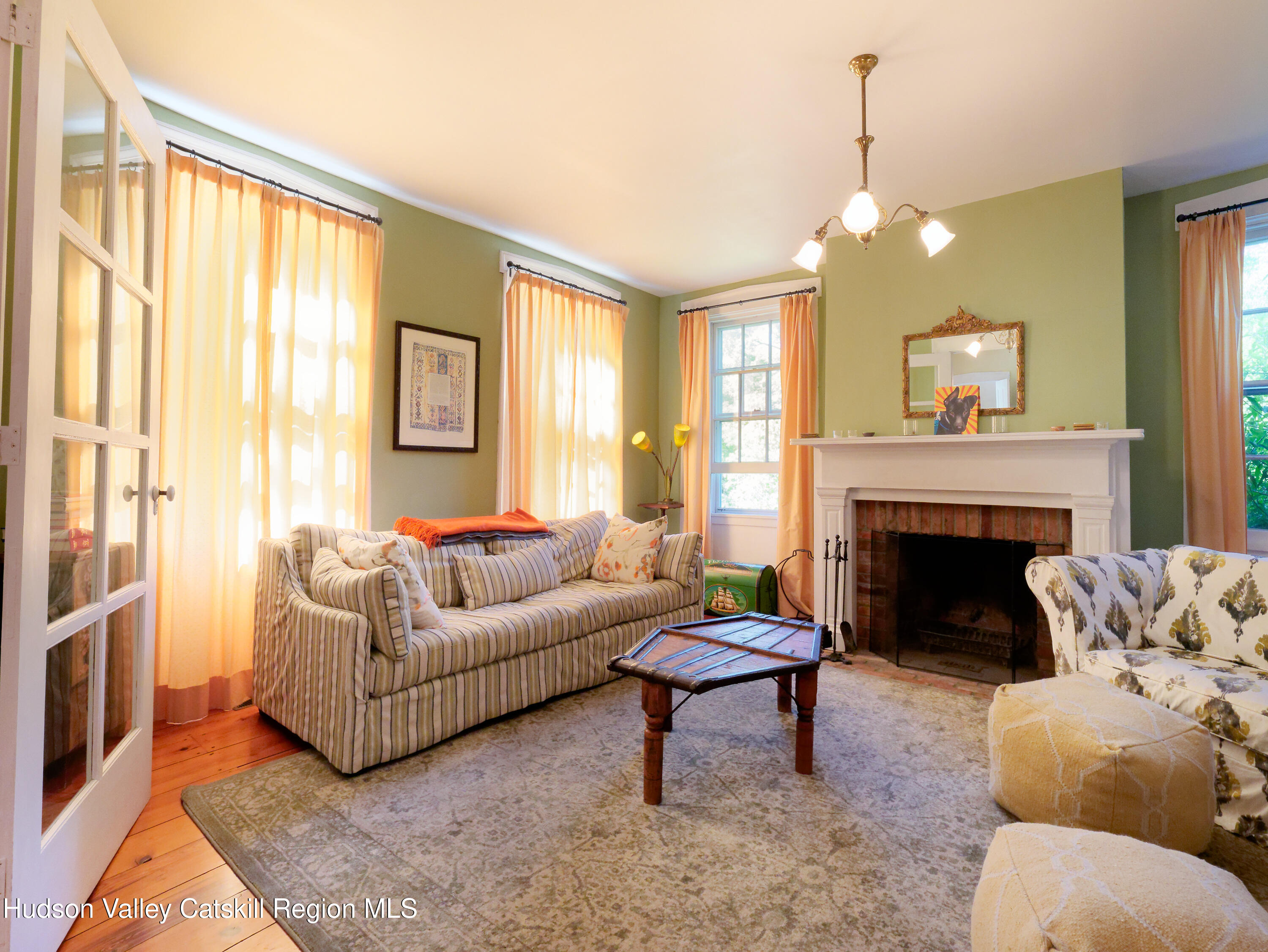 5 Fulton Homestead Road Red Hook, NY 12571 - Photo 12 of 41 a living room with furniture and a fireplace