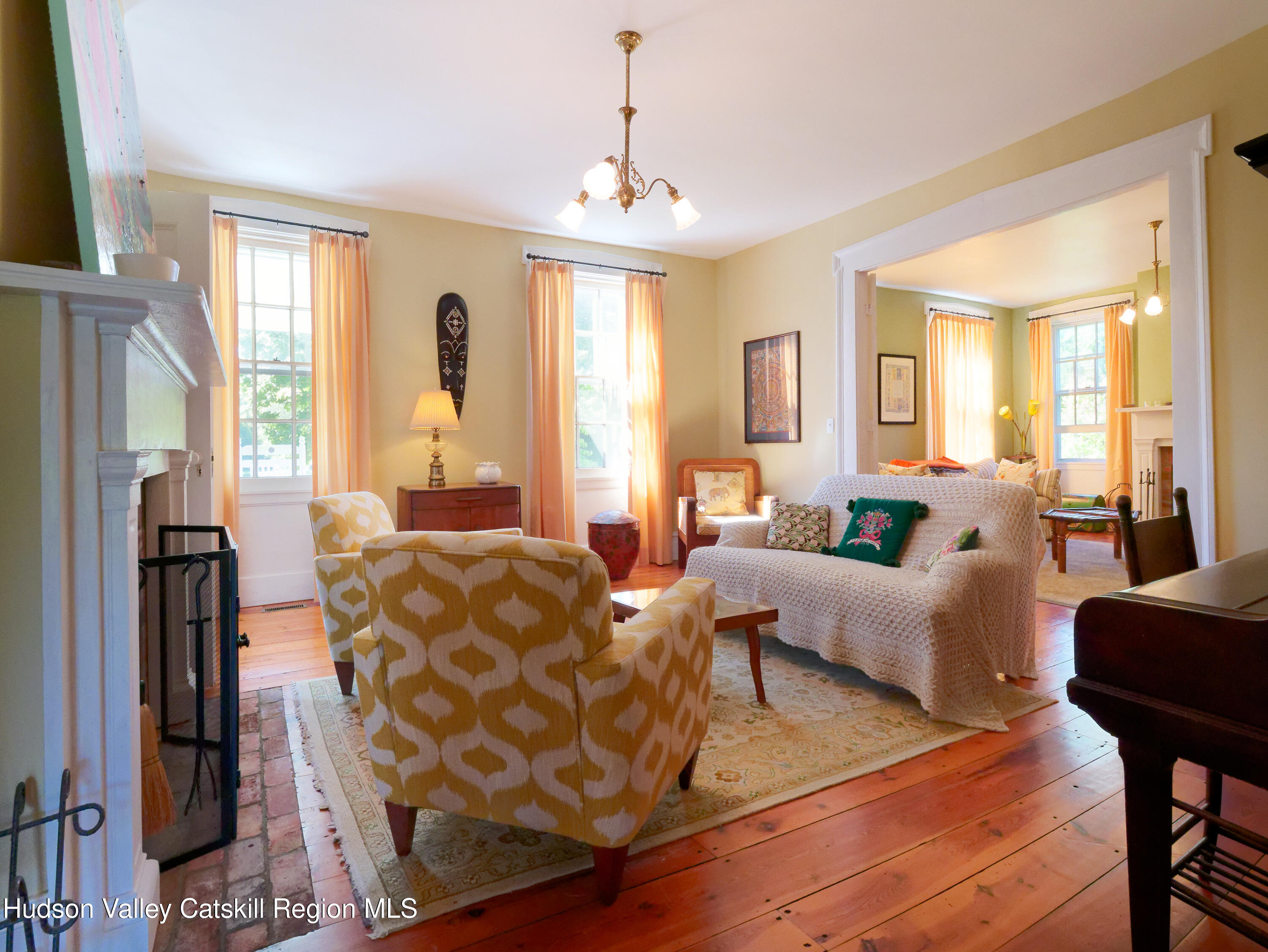 5 Fulton Homestead Road Red Hook, NY 12571 - Photo 13 of 41 a living room with furniture fireplace and a large window