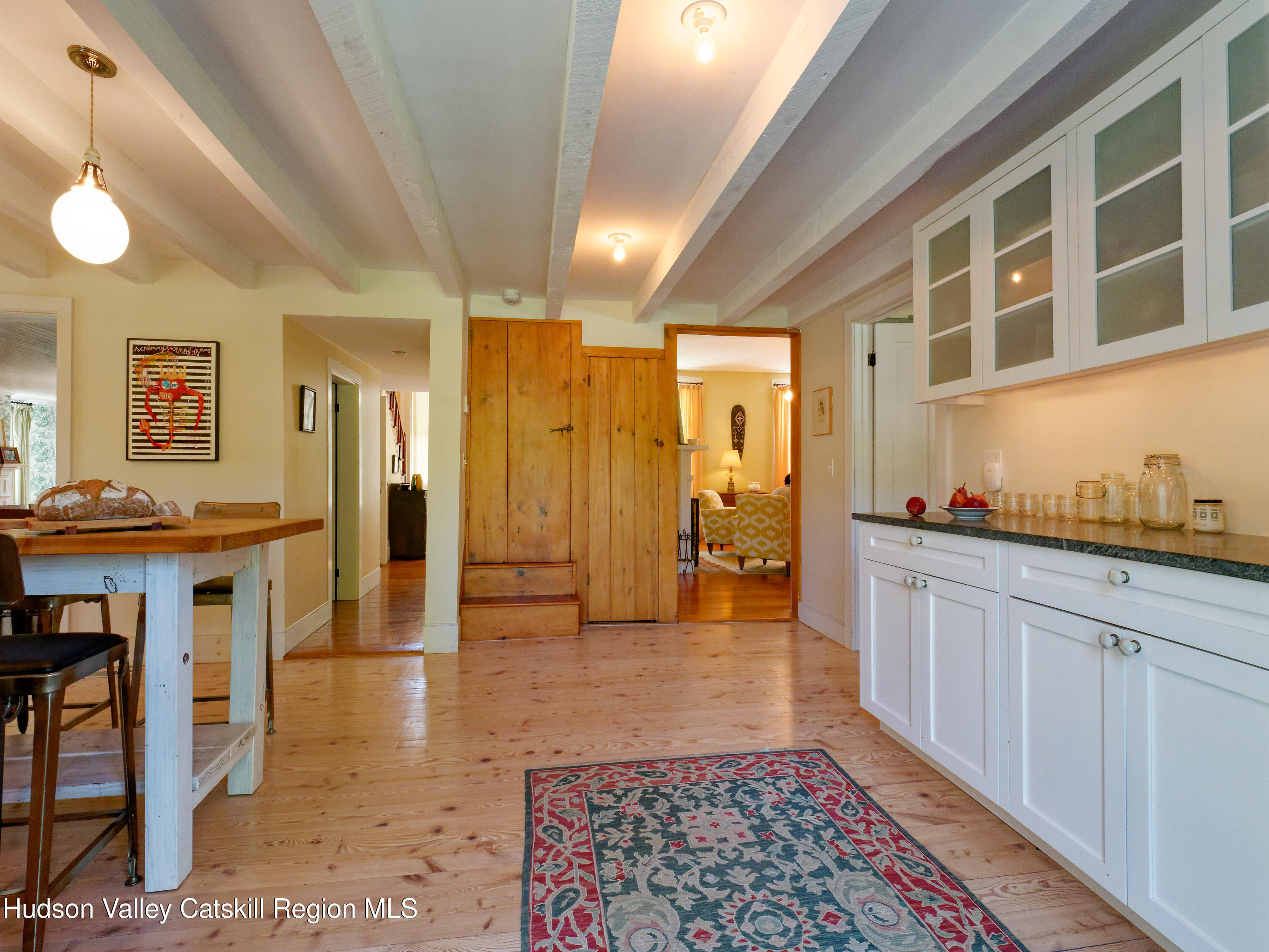 5 Fulton Homestead Road Red Hook, NY 12571 - Photo 17 of 41 a view of a hallway with wooden floor and chandelier