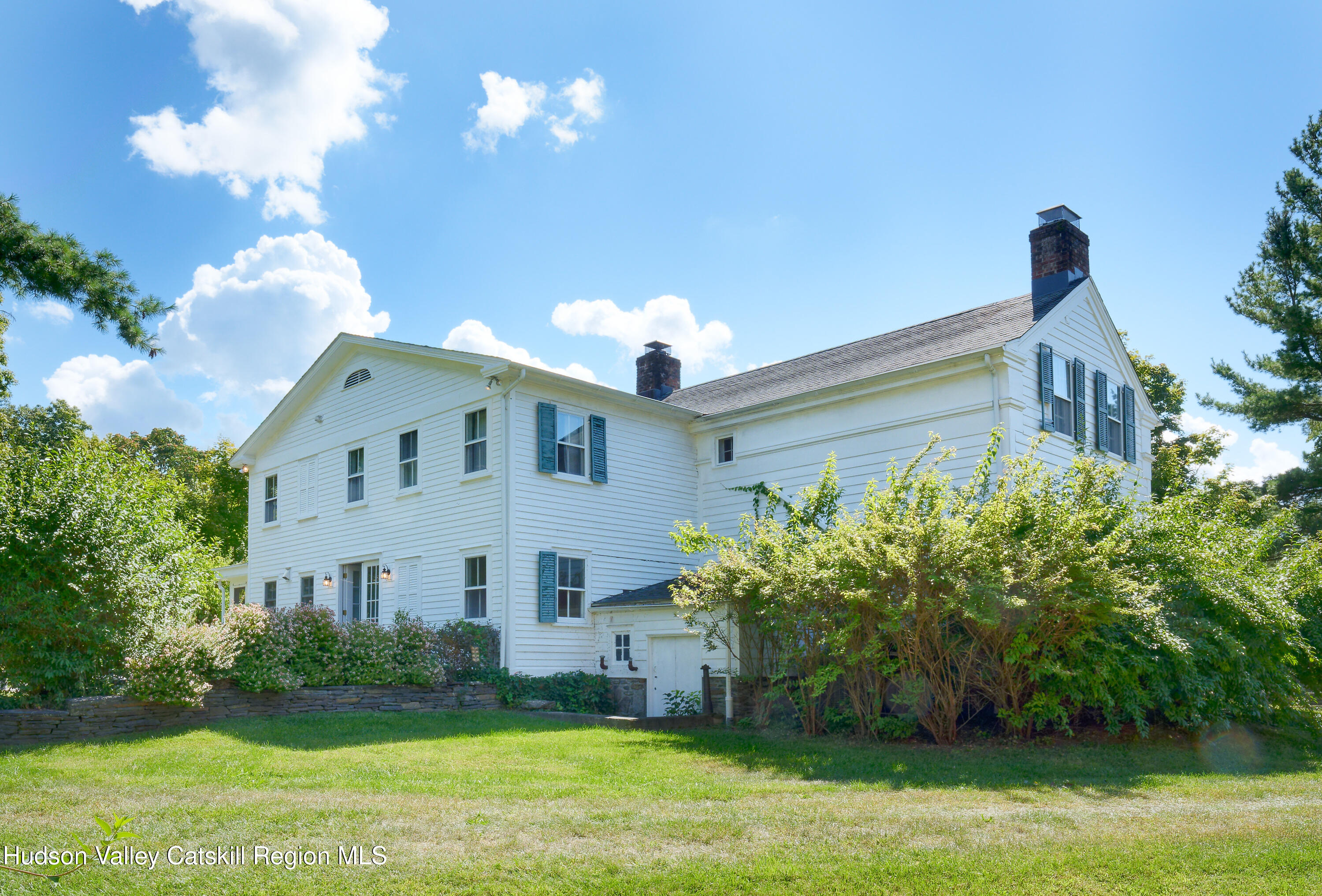 5 Fulton Homestead Road Red Hook, NY 12571 - Photo 3 of 41 a front view of a house with garden