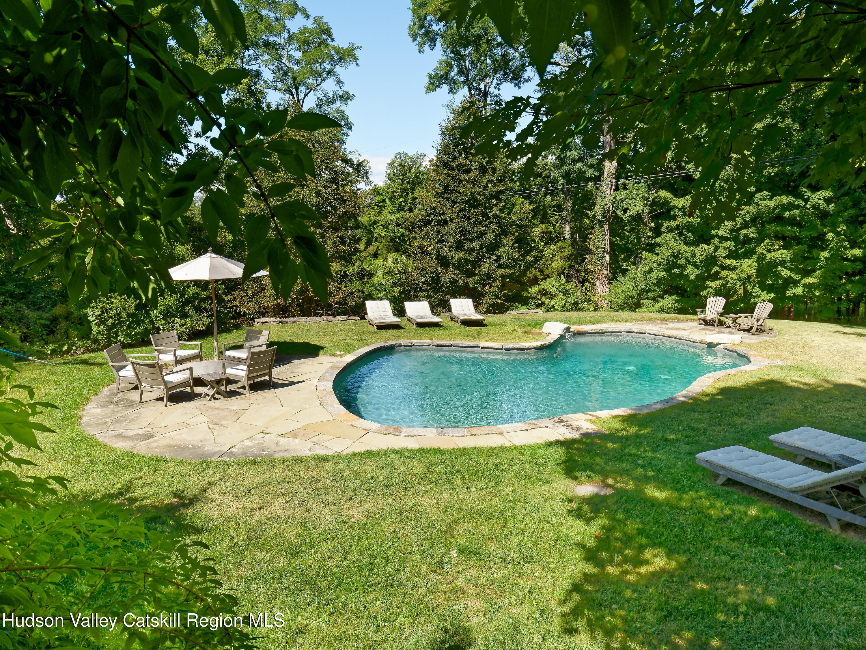 5 Fulton Homestead Road Red Hook, NY 12571 - Photo 31 of 41 a view of a swimming pool with lounge chair