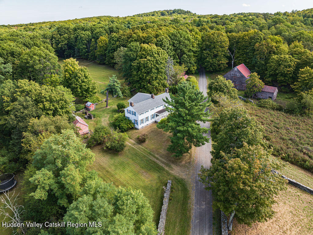5 Fulton Homestead Road Red Hook, NY 12571 - Photo 4 of 41 a backyard of a house with a yard and outdoor seating