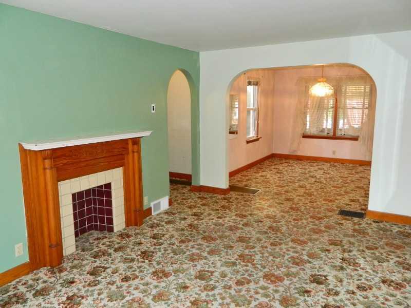 975 Ridge Road Ambridge, PA 15003 - Photo 3 of 25 Living Room. Also features a decorative fireplace.