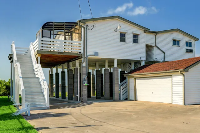 a front view of a house with a garage