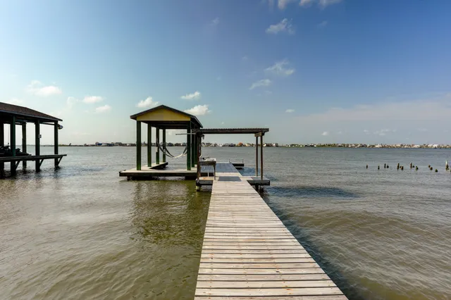 a view of a swimming pool and lounge chair