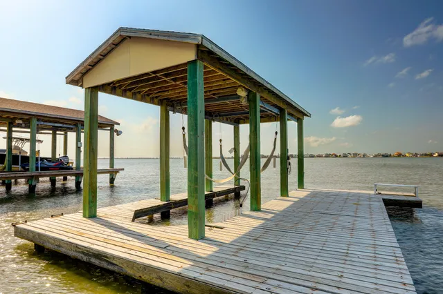a view of a balcony with couch and wooden floor