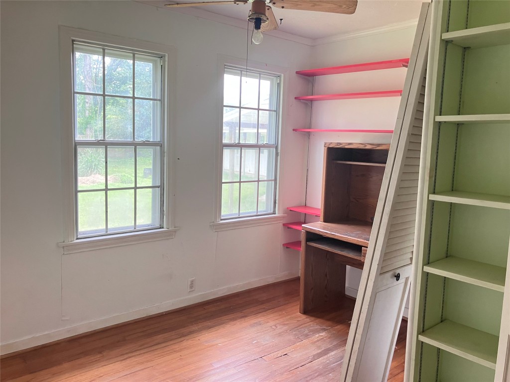 5012 Winding Way Dickinson, TX 77539 - Photo 13 of 23 a view of a workspace with furniture and a window