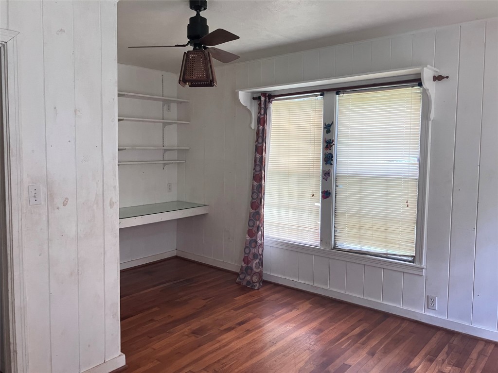 5012 Winding Way Dickinson, TX 77539 - Photo 14 of 23 a view of an empty room with a window and wooden floor