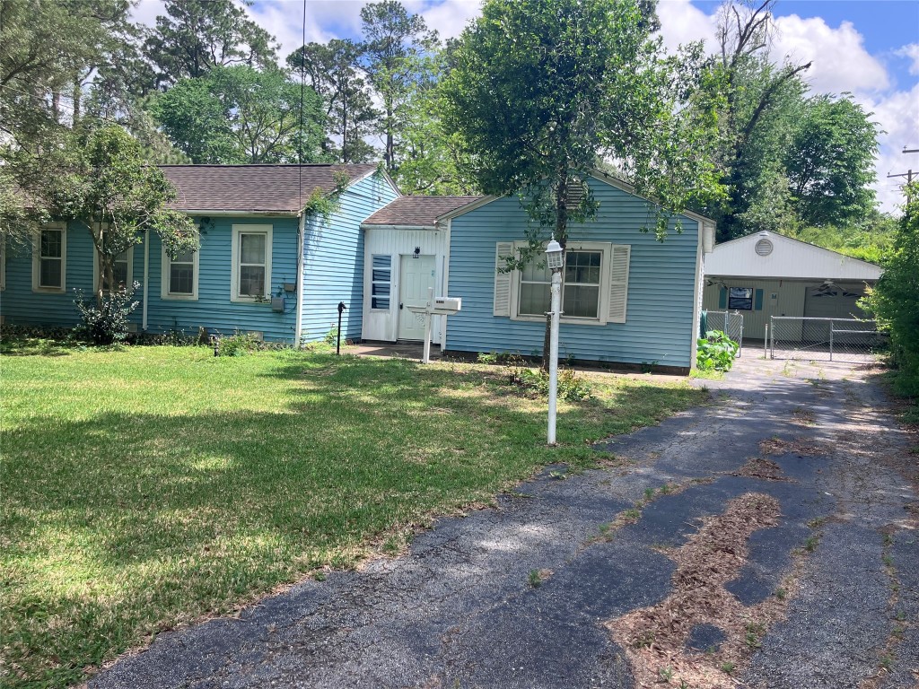 5012 Winding Way Dickinson, TX 77539 - Photo 22 of 23 a view of a house with a yard