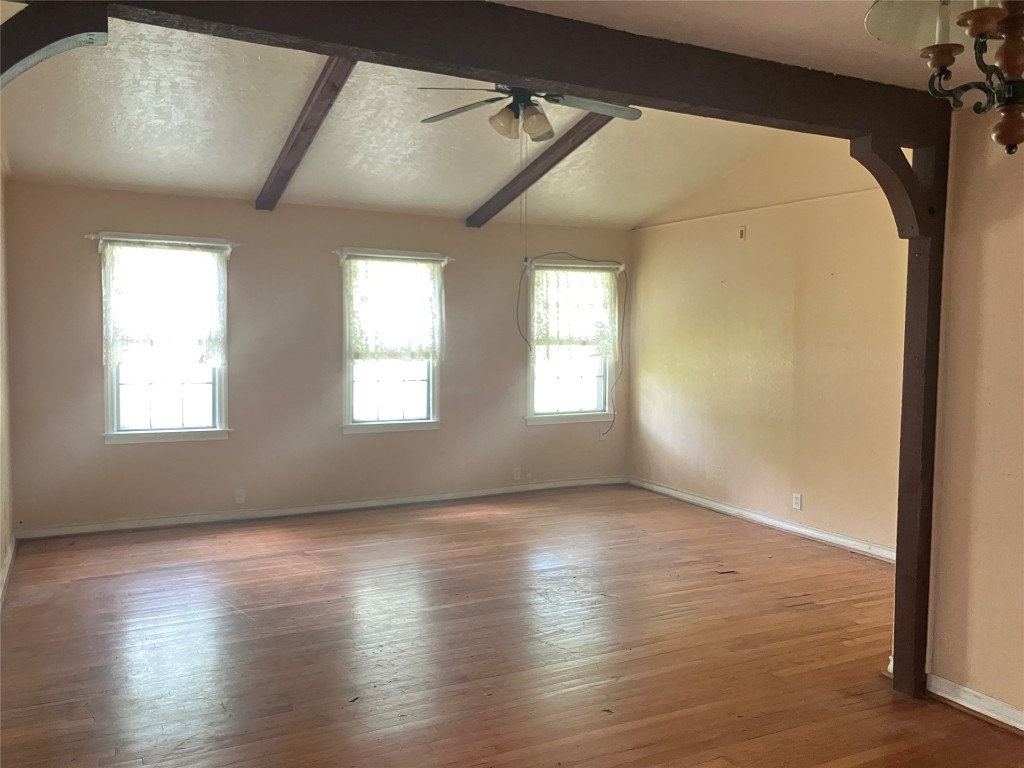 5012 Winding Way Dickinson, TX 77539 - Photo 9 of 23 an empty room with wooden floor and windows