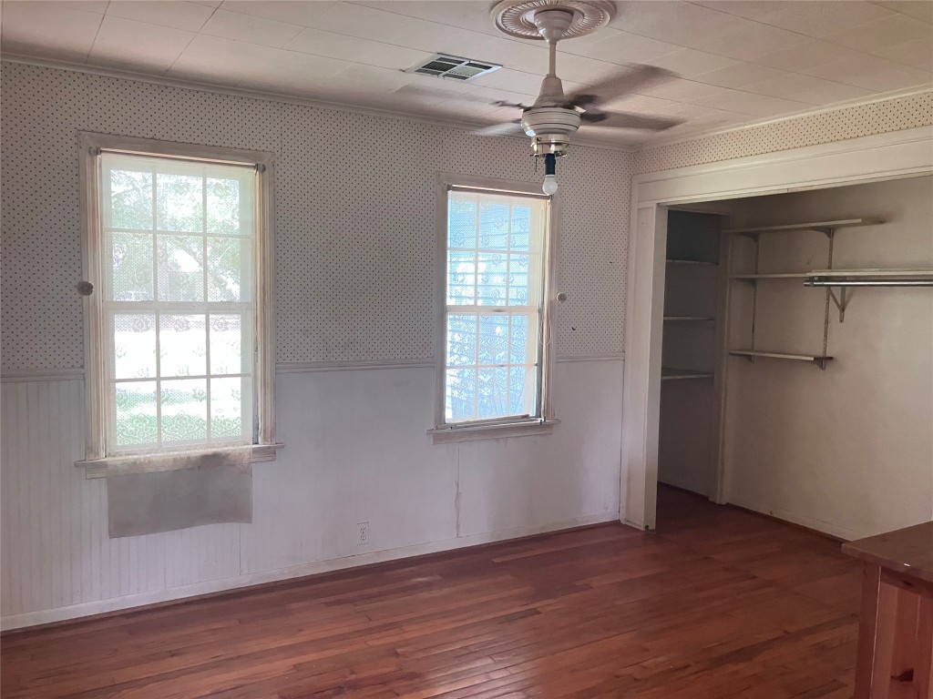 5012 Winding Way Dickinson, TX 77539 - Photo 10 of 23 a view of an empty room with wooden floor and a window