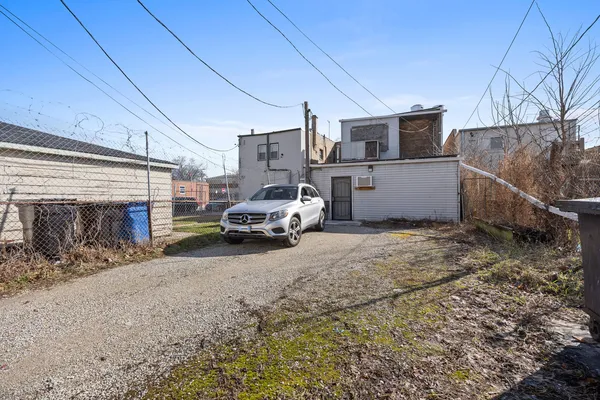 a view of a car park in front of house