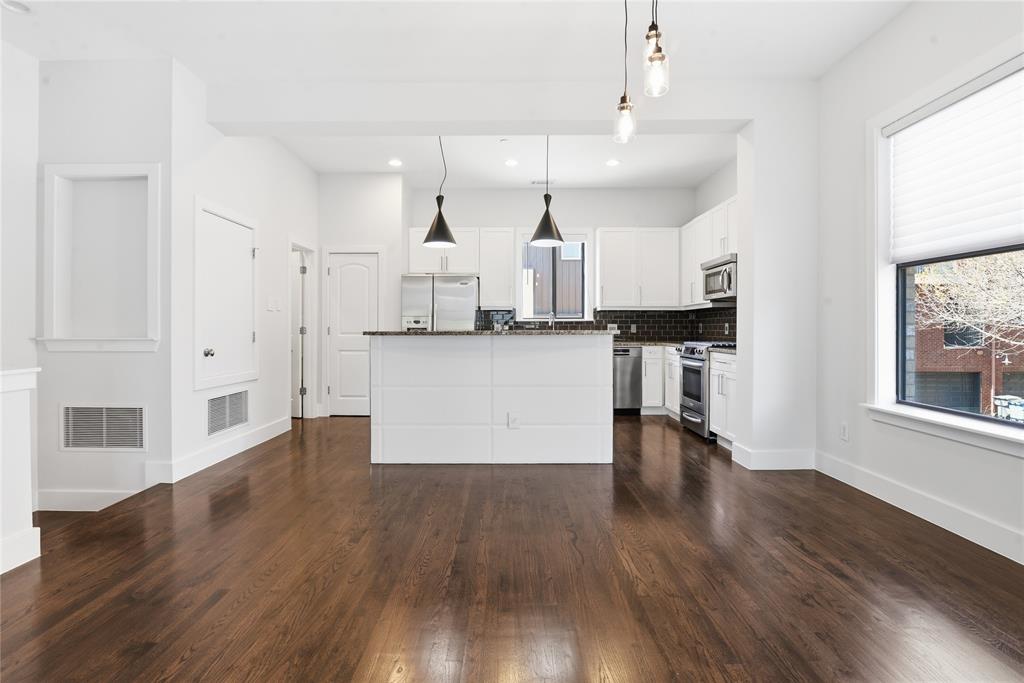 4211 Rawlins Street, Unit 530 Dallas, TX 75219 - Photo 13 of 33 a view of kitchen with wooden floor and electronic appliances