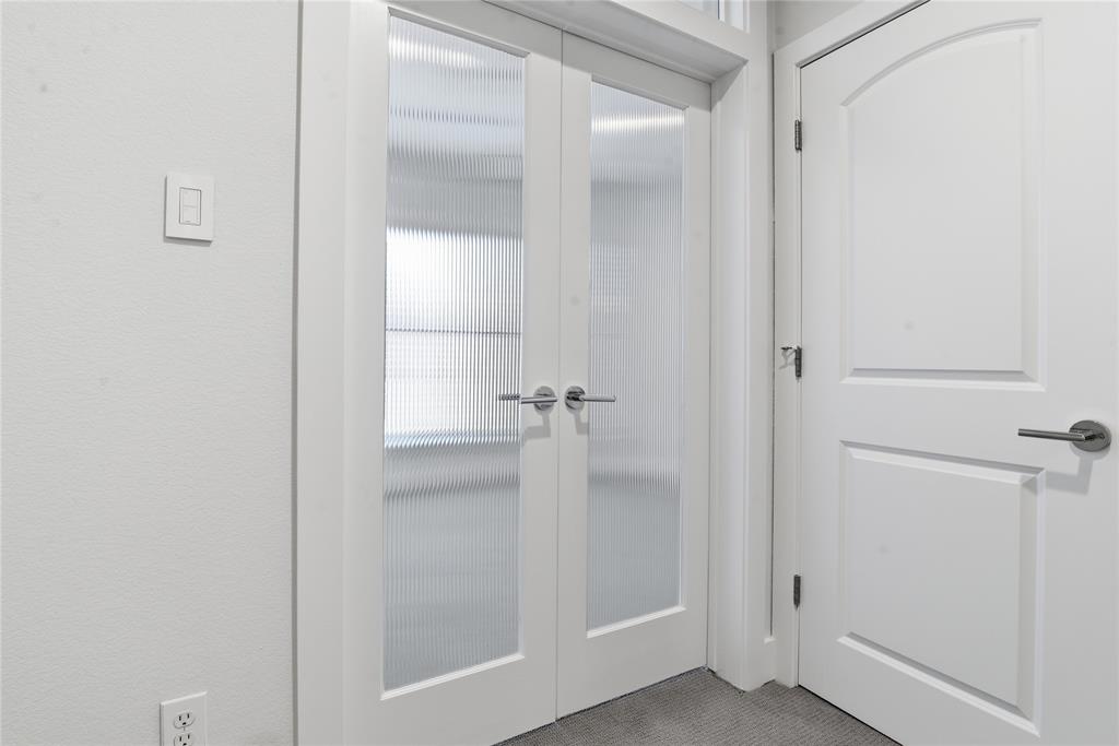 4211 Rawlins Street, Unit 530 Dallas, TX 75219 - Photo 22 of 33 a bathroom with a glass shower door