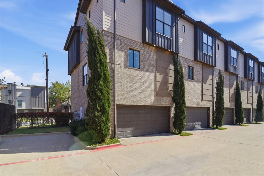 4211 Rawlins Street, Unit 530 Dallas, TX 75219 - Photo 27 of 33 a front view of a building with a garden and plants