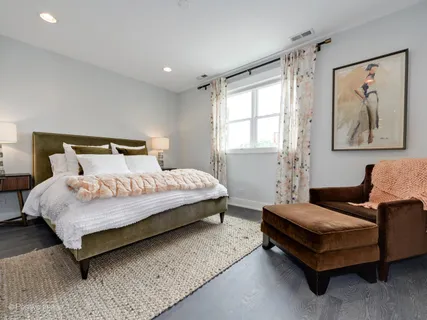 a bedroom with a bed and glass window