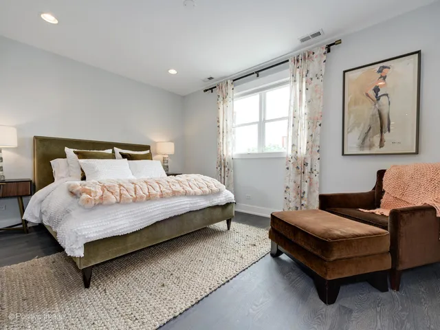 a bedroom with a bed and glass window